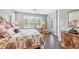 Primary bedroom featuring hardwood floors and large windows at 7710 Seven Oaks Dr, Bradenton, FL 34201