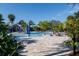 Beautiful community pool featuring a splash area, tables and sun umbrellas for relaxation and play at 7710 Seven Oaks Dr, Bradenton, FL 34201