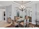 Formal dining area with seating for six under an elegant chandelier at 7710 Seven Oaks Dr, Bradenton, FL 34201
