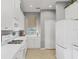 Bright kitchen features white cabinetry, modern appliances and a window at 7710 Seven Oaks Dr, Bradenton, FL 34201