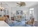 A cozy living room with hardwood flooring, neutral walls and views of other rooms at 7710 Seven Oaks Dr, Bradenton, FL 34201