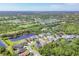 Aerial view of a community with lakes, golf course, and mature landscaping at 7816 Ashley Cir, University Park, FL 34201