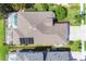 Overhead view of the home showing the screened-in lanai, well-maintained landscaping and the roof at 7816 Ashley Cir, University Park, FL 34201