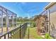 View of backyard featuring a lake view with a screened in porch at 7816 Ashley Cir, University Park, FL 34201