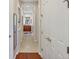 Hallway featuring beautiful archway leading to the primary bathroom at 7816 Ashley Cir, University Park, FL 34201