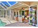 Covered patio with comfortable seating and pool views is perfect for outdoor relaxation at 7816 Ashley Cir, University Park, FL 34201