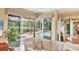 View of screened lanai, pool, and spa from the living room of the home at 7816 Ashley Cir, University Park, FL 34201