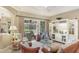 Bright and comfortable living room with lanai views and custom built-ins at 7816 Ashley Cir, University Park, FL 34201