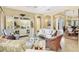 Open concept living room features arched doorways, recessed lighting and custom built-ins at 7816 Ashley Cir, University Park, FL 34201
