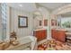 Elegant bathroom with striped walls, soaking tub, and dual sinks at 7816 Ashley Cir, University Park, FL 34201
