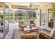 Covered lanai offering a beautiful pool view and multiple seating areas at 7816 Ashley Cir, University Park, FL 34201