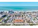 Scenic aerial view showcases beachfront condos and neighborhood homes with easy access to the white sandy beach and ocean at 800 S Blvd Of The Presidents # 3, Sarasota, FL 34236