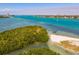Breathtaking view of clear ocean water, kayakers, and a pristine beach with people enjoying outdoor recreation at 800 S Blvd Of The Presidents # 3, Sarasota, FL 34236