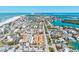 Stunning aerial view of beachfront homes and community, near the turquoise ocean waters in a vibrant coastal setting at 800 S Blvd Of The Presidents # 3, Sarasota, FL 34236