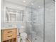Contemporary bathroom featuring a glass shower, vanity with wood accents, and modern fixtures at 800 S Blvd Of The Presidents # 3, Sarasota, FL 34236