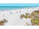 Picturesque beach scene with pristine white sand, clear turquoise water, and lush coastal vegetation, perfect for a relaxing retreat at 800 S Blvd Of The Presidents # 3, Sarasota, FL 34236