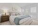 Comfortable bedroom features a king bed, shutters, and stylish decor for a relaxing retreat at 800 S Blvd Of The Presidents # 3, Sarasota, FL 34236