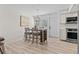Charming dining area with seating for four adjacent to the kitchen at 800 S Blvd Of The Presidents # 3, Sarasota, FL 34236