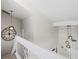 Bright interior view showcasing modern lighting fixtures, a staircase, and tasteful wall decor at 800 S Blvd Of The Presidents # 3, Sarasota, FL 34236