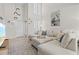Inviting living room space with large sectional, coastal decor and plenty of natural light at 800 S Blvd Of The Presidents # 3, Sarasota, FL 34236