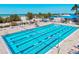 Inviting swimming pool featuring lane markers, lifeguard stand, and beachfront access, perfect for swimming laps or relaxing poolside at 800 S Blvd Of The Presidents # 3, Sarasota, FL 34236