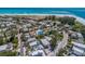 Aerial view showcasing the home's proximity to the beach and its location within a charming residential neighborhood at 805 N Bay Blvd, Anna Maria, FL 34216