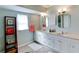 Bright bathroom with double sinks, and tile flooring at 805 N Bay Blvd, Anna Maria, FL 34216