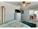 Bright bedroom with view of balcony and comfortable furniture at 805 N Bay Blvd, Anna Maria, FL 34216