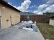 View of the patio with an umbrella, table, and chairs perfect for outdoor entertaining at 831 Bacon Ave, Sarasota, FL 34232