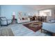 Spacious living area with open flow to the dining and kitchen space at 9641 Castle Point Dr # 1211, Sarasota, FL 34238