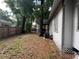 Backyard view with AC Unit near side of home at 1002 E Ida St, Tampa, FL 33603