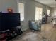 Bright living room with light gray walls, wood flooring, and lots of natural light at 1002 E Ida St, Tampa, FL 33603