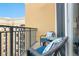 This balcony features comfortable seating, perfect for enjoying the outdoor space at 1064 N Tamiami Trl # 1604, Sarasota, FL 34236