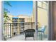 Cozy balcony with outdoor seating offers a relaxing space with a view of the community at 1064 N Tamiami Trl # 1604, Sarasota, FL 34236
