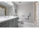 Updated bathroom features a modern vanity and coordinated shower curtain at 1064 N Tamiami Trl # 1604, Sarasota, FL 34236