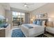 Cozy bedroom with balcony, sleek furnishings, and soft lighting for a relaxing ambiance at 1064 N Tamiami Trl # 1604, Sarasota, FL 34236