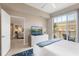 Inviting bedroom boasts a private balcony, TV and comfortable contemporary furniture at 1064 N Tamiami Trl # 1604, Sarasota, FL 34236