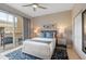 Bright bedroom with balcony access, plush bedding, and stylish contemporary décor at 1064 N Tamiami Trl # 1604, Sarasota, FL 34236