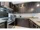 Well-equipped kitchen features stainless steel appliances, granite counters, and ample cabinet space at 1064 N Tamiami Trl # 1604, Sarasota, FL 34236