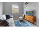 Bright living room featuring neutral tones, cozy furniture, and a view outside at 1064 N Tamiami Trl # 1604, Sarasota, FL 34236