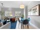 Cozy living space featuring a glass dining table and comfortable seating at 1064 N Tamiami Trl # 1604, Sarasota, FL 34236