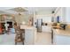 The modern kitchen overlooks the living area with stainless steel appliances and lots of natural light at 108 Amora Ave, Venice, FL 34285