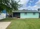 Spacious backyard featuring well-maintained grass and a screened-in porch at 109 Colonia W Ln, Nokomis, FL 34275