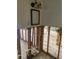 Bathroom undergoing renovation, the walls are open with exposed studs, and a mirror on wall at 109 Colonia W Ln, Nokomis, FL 34275