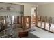 Dining Room under renovation, walls are open with exposed studs, unfinished floors, and old furniture at 109 Colonia W Ln, Nokomis, FL 34275