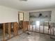 Living Room undergoing renovation, walls are open with exposed studs, and the flooring is unfinished at 109 Colonia W Ln, Nokomis, FL 34275