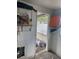 View inside storage room revealing concrete walls, a glimpse of outdoor space and storage at 109 Colonia W Ln, Nokomis, FL 34275