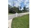 Street view of the property featuring a well-manicured lawn and a classic white mailbox at 109 Colonia W Ln, Nokomis, FL 34275