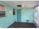 Bright sunroom with natural light, features a ceiling fan, and access door to the outside at 109 Colonia W Ln, Nokomis, FL 34275