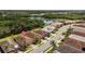 Aerial shot displays attractive homes with tile roofs and manicured landscaping, with a location marker at 11499 Renaissance Blvd, Venice, FL 34293